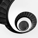 Black and white abstract view of a spiral staircase in Nürnberg, Germany.